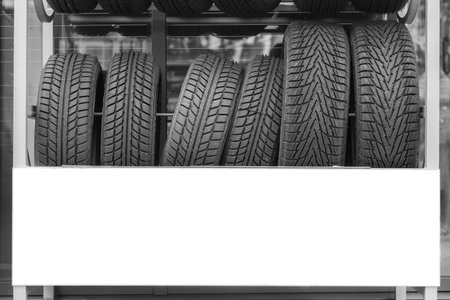 Car tires for the vehicle are stored for sale at the gas station.