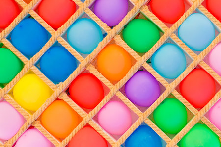 Bright colored air balloons background for play darts.の写真素材
