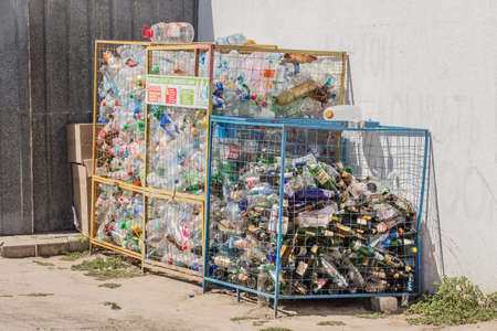 Ukraine, Iron Port - August 25, 2020: Garbage and waste plastic and glass bottles of pollution are stored for recycling and disposal.のeditorial素材