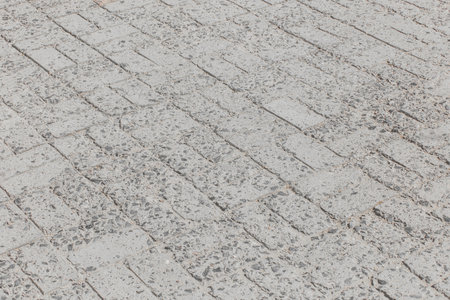 Surface urban old floor texture paving stone mosaic tiles road cement background.