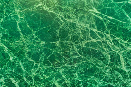 Malachite slab, green marble surface with cracks, kitchen interior, abstract pattern texture background.の写真素材
