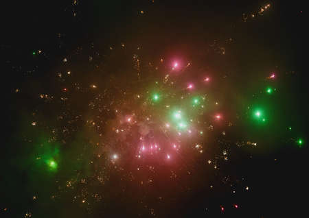 Bright colorful fireworks against the night black sky resembling a galaxy background.の写真素材