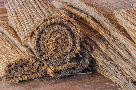Straw rope dry reed natural material is stored in rolls.
