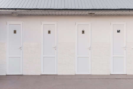 Doors of the public toilet booth wc sanitary background.の写真素材