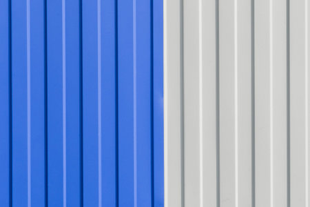 Blue and White Painted Sheet Metal Plates Iron Fence Texture Background.