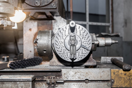 Part of the old equipment for metalworking milling machine close-up in the shop of the industrial...