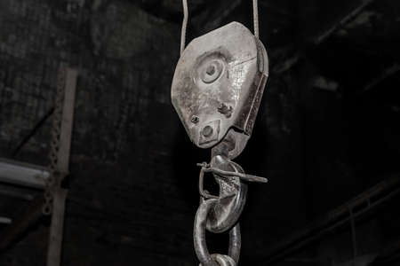 Lifting heavy mechanism equipment industrial crane hook at the factory.の写真素材