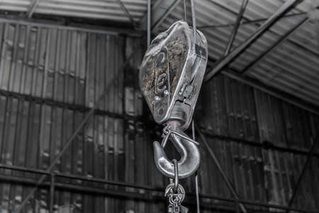Lifting mechanism iron chain with hook equipment heavy crane at factory.の写真素材