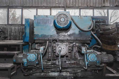 Old milling machine equipment with electric flange motors tool for metalworking in the workshop of...