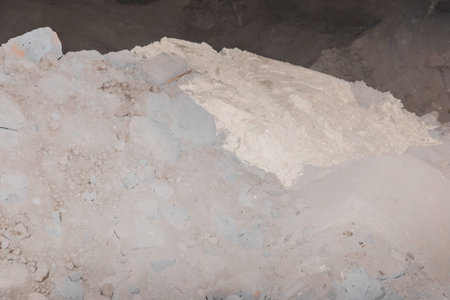Mixture in a pile of bentonite clay and sand, processing of land and soil industry.