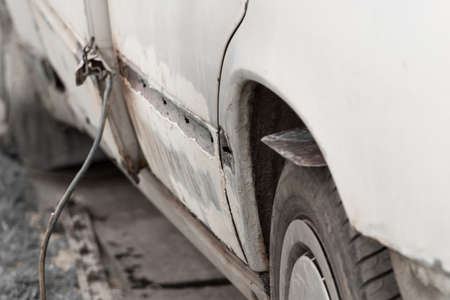 Repair of the rear door of the car. Elimination of the broken body of transport.の写真素材