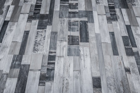 Dark gray floor wooden surface parquet or laminate texture background.