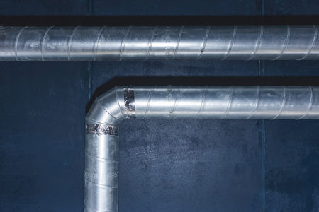 Ventilation pipe system at the ceiling of an industrial enterprise or plant premises.