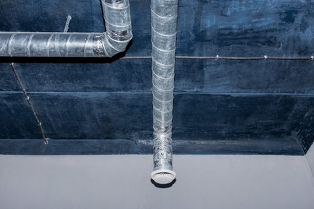 Ventilation pipe system at the ceiling of an industrial enterprise or plant premises.