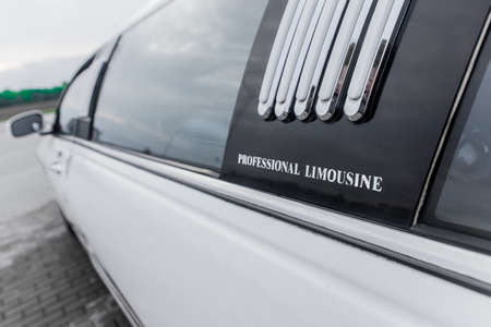 Part of the luxury car design white limousine and window, close-up.の写真素材
