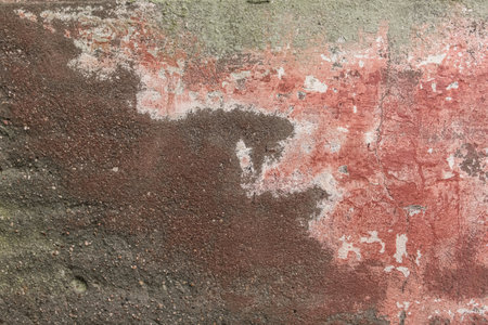 Old dirty dark cement wall with traces of mold and water stains texture damaged disturbed background.の写真素材