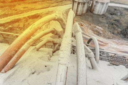 Old system of pipes on the barrel. White fertilizers or sand pipeline filtration of chemical and...