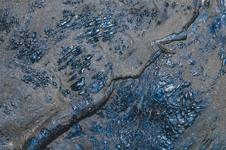 Old roofing felt material on the roof cover bitumen surface texture background.