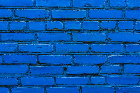 Blue paint on the old brick rough wall texture grunge background.の写真素材