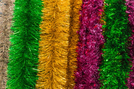 Christmas bright colored tinsel decor and christmas background decorations.の写真素材
