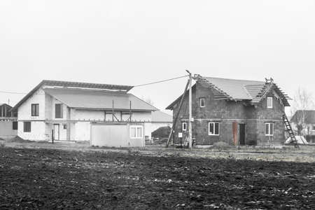 Unfinished construction in rural area. Unfinished building outdoor house in the village.の写真素材