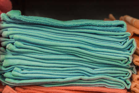 blue and aqua green clean towels soft hygiene at home in bathroom background.の写真素材