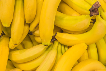 A bunch of yellow ripe fresh fruit organic banana background.の写真素材