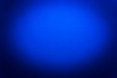Dark blue background empty grunge wall abstract spotlight surface vignette.の写真素材