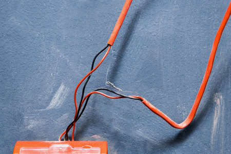 Old red wires connection system to fire alarm, close up.の写真素材