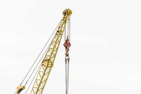 Lifting mechanism of the machine bridge crane with steel cable and hook on a white background.の写真素材