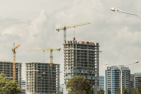 Tower crane, development of urban structures and construction of houses industry architecture.の写真素材
