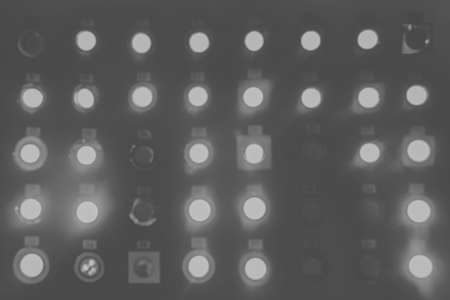 Blurry unsharp abstract shiny background of glowing light bulbs and lamps in the store.の写真素材