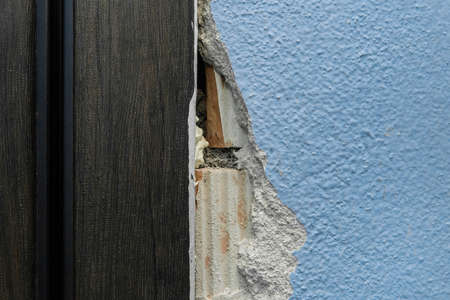 Old broken damaged concrete wall in need of repair and reconstruction of the apartment architecture of the house.の写真素材