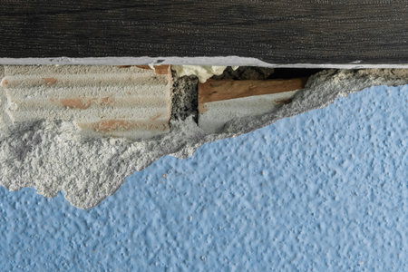 Old broken damaged concrete wall in need of repair and reconstruction of the apartment architecture...