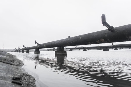 Old steel rusty abandoned pipes of the water cooling pipeline system of the combined heat and power...