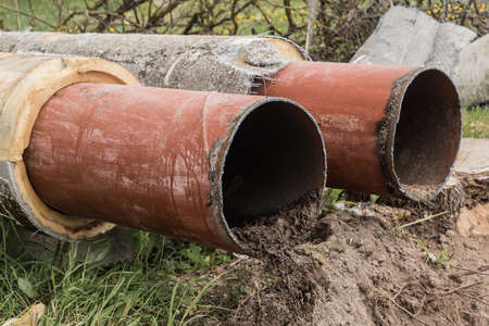 Repair of the pipeline line steel round pipe the heating main in the ground construction work industrial.の写真素材