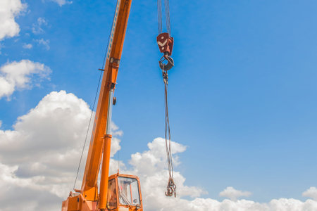 Lifting hoisting mechanism with rope steel of the machine bridge crane with iron cable and hook on a...