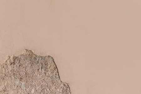 Peeling old plaster with damaged concrete wall cement weathered texture broken background.の写真素材