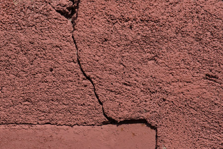 Crack on old ruined wall cracked concrete damaged texture worn background broken surface.の写真素材