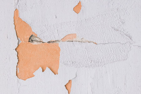 Peeling paint plaster with old weathered concrete obsolete wall cement worn texture messy background.の写真素材
