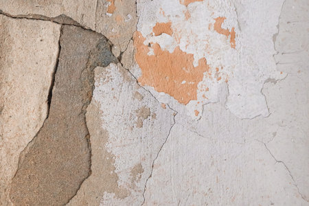 Peeling paint plaster with old weathered concrete obsolete wall cement worn texture messy...