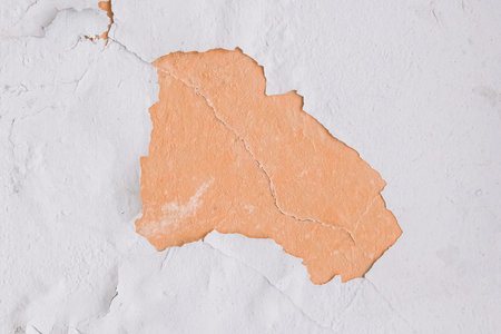 Peeling paint plaster with old weathered concrete obsolete wall cement worn texture messy...
