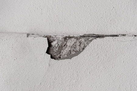 Broken old concrete wall surface cement white damage background.