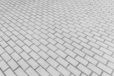 Gray sidewalk tile street stone city road abstract urban pattern design texture paving floor background.の写真素材