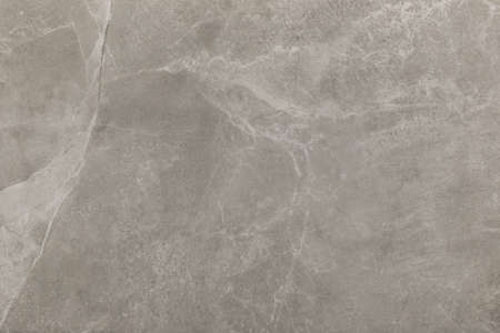 Gray Beige Marble Ceramic Floor Tile with Abstract Stone Pattern Surface Gray Texture Background.の写真素材