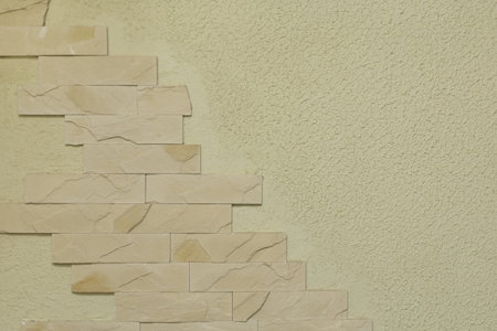 Light brick element fragment abstract interior design wall pattern warm sand clay color texture facade background.の写真素材