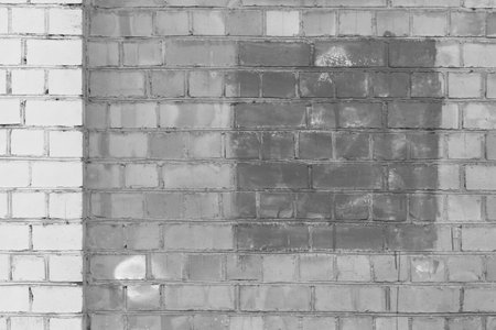 Brick wall gray facade exterior urban building with empty space paint design object blank sample gray background.の写真素材