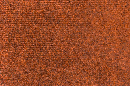 Carpet fabric orange brown texture textile pattern material surface soft floor abstract background.