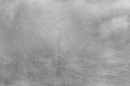 Gray scratched old metal surface steel abstract pattern texture silver background.