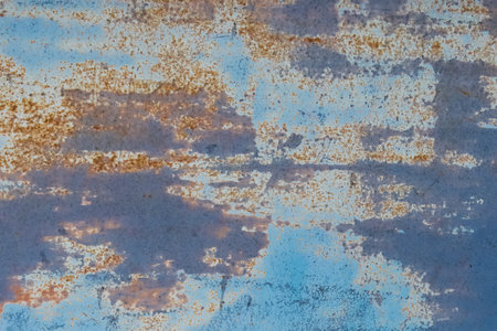 Rusty scratched peeling outdated metallic texture steel weathered blue background grunge pattern...